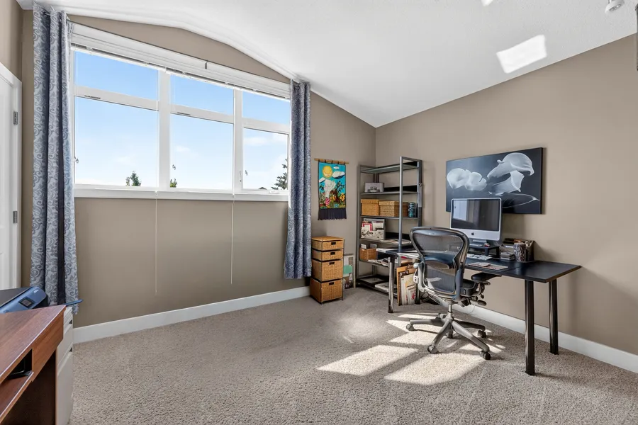 Upper-level office with vaulted ceiling