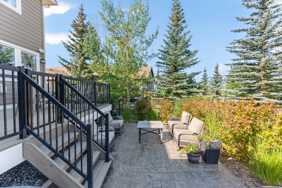 Deck stairs to the patio, backing the greenbelt