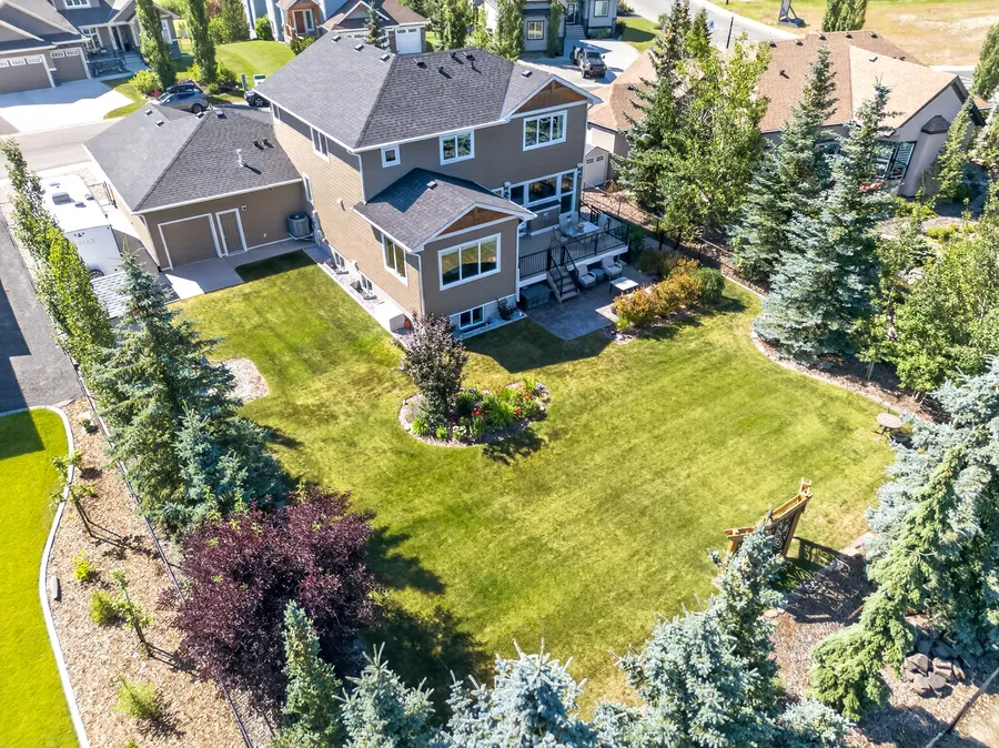 Aerial view of the home and rear grounds